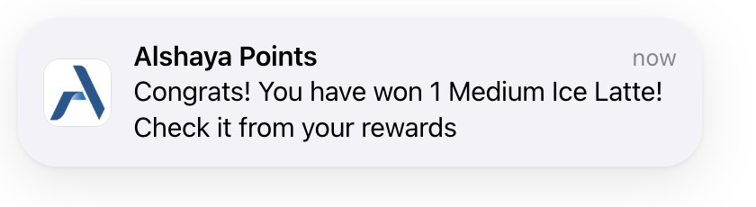 Branded push notification on iOS: brand icon, card name and the reward message.